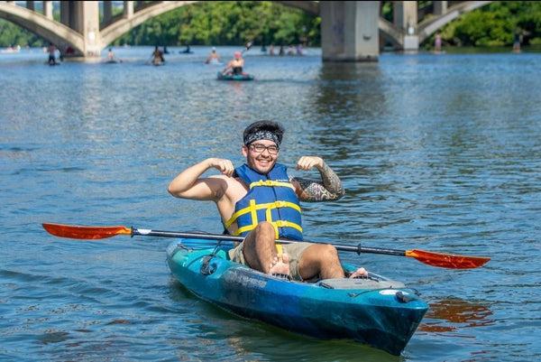 couple with paddles