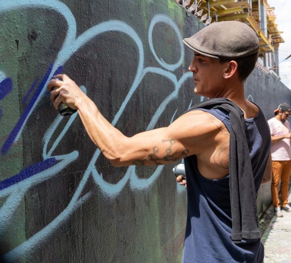 woman posed for photo with street art