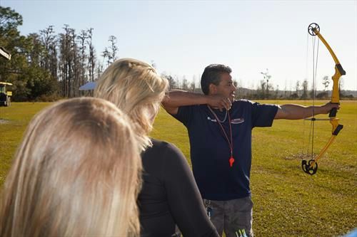 man demonstrating archery