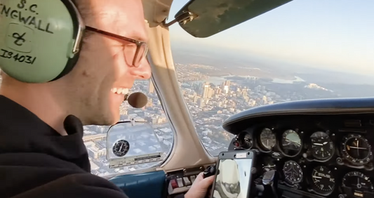 man flying airplane