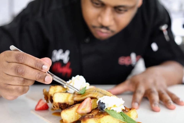 man plating food