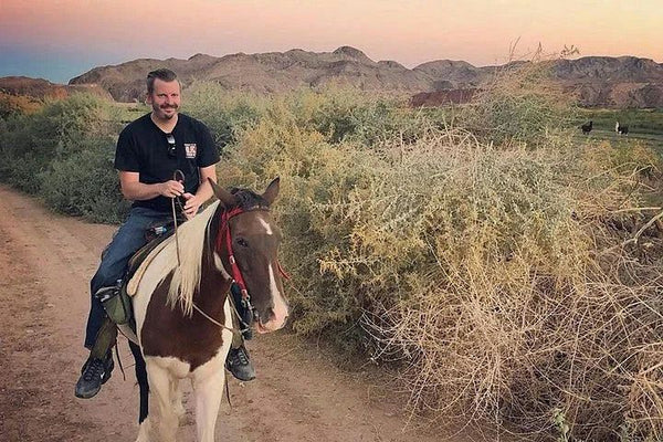 two girls riding horses