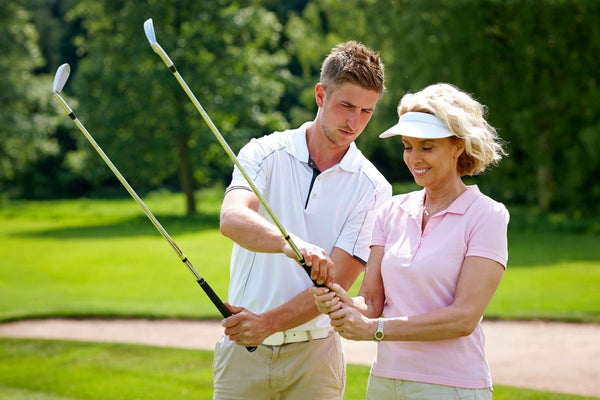 golfers smiling with golf cart