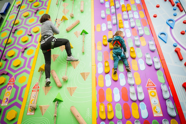 parent helping child climb