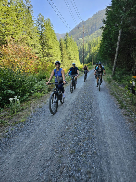 group of bikers in front of tunnel