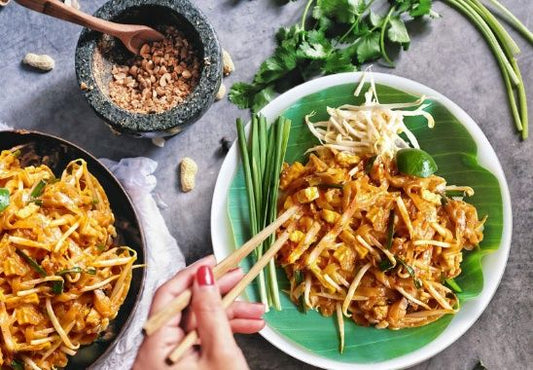 pad thai being plated