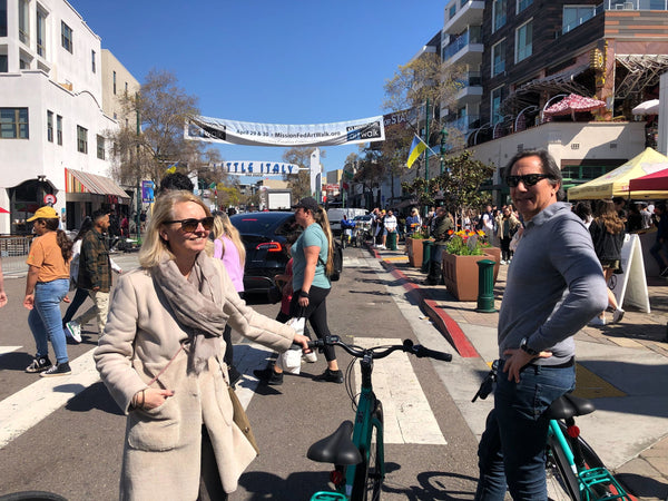 woman on bike by docks