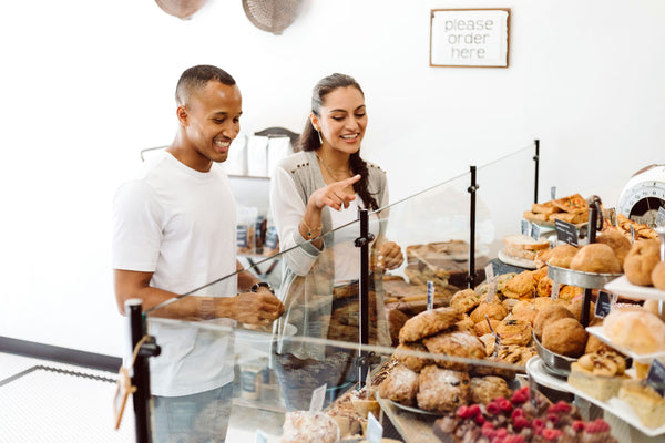 pointing at croissants in bakery