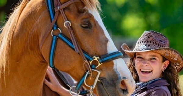 3 girls with horses.webp