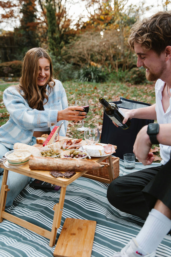 reaching for picnic food