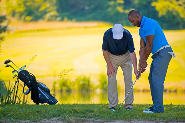 golfers smiling with golf cart