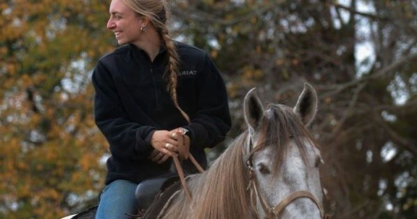 3 girls with horses.webp