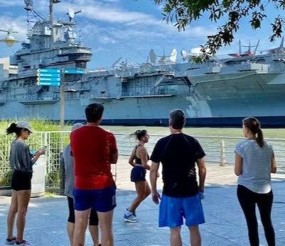 group of runners by a boat.jpg