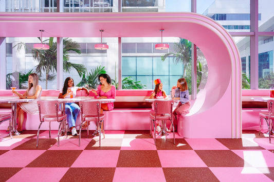 sitting in pink diner