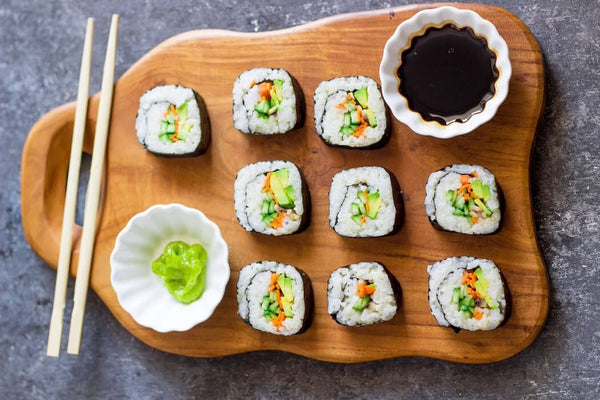 hand rolling sushi