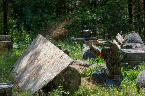 guy shooting paintball