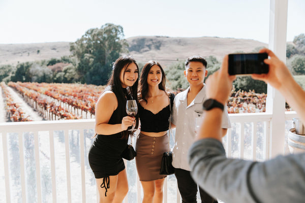 couple with wine glasses in castle