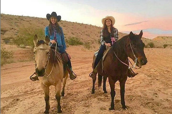 horseback riding at sunset