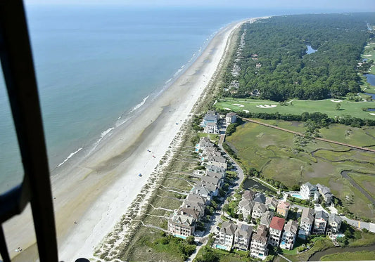 family on beach with helicopter.webp