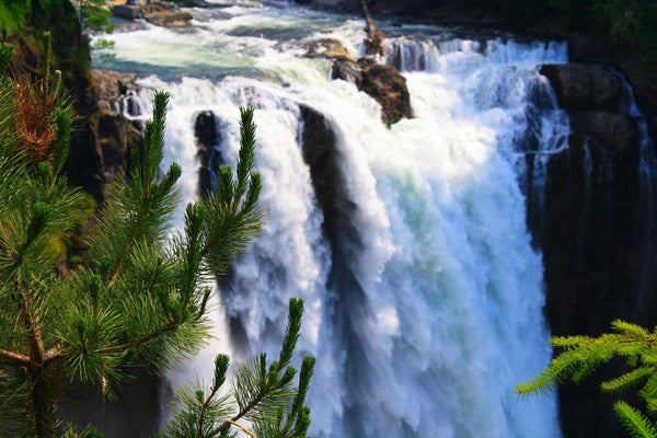 woman in front of waterfall