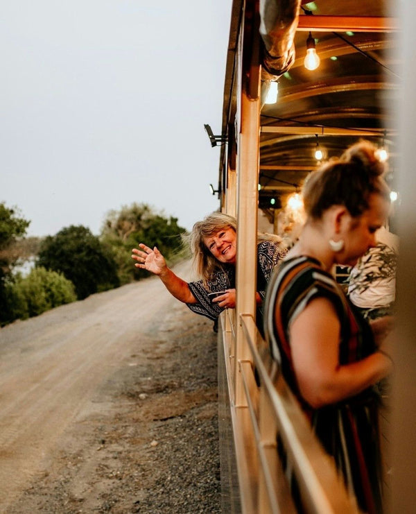 women with wine on train