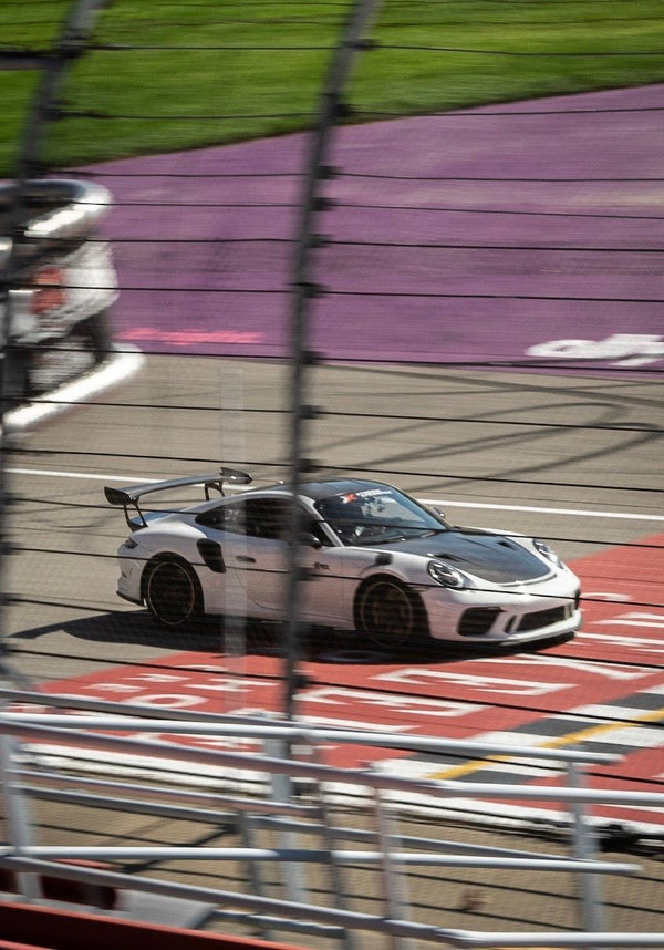 Green supercar on track