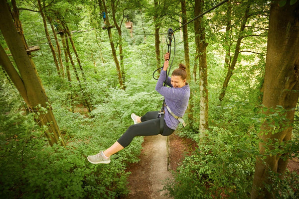 man really having a blast zip lining