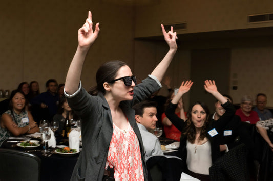 woman pointing to ceiling