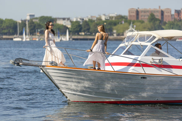 women chilling on boat