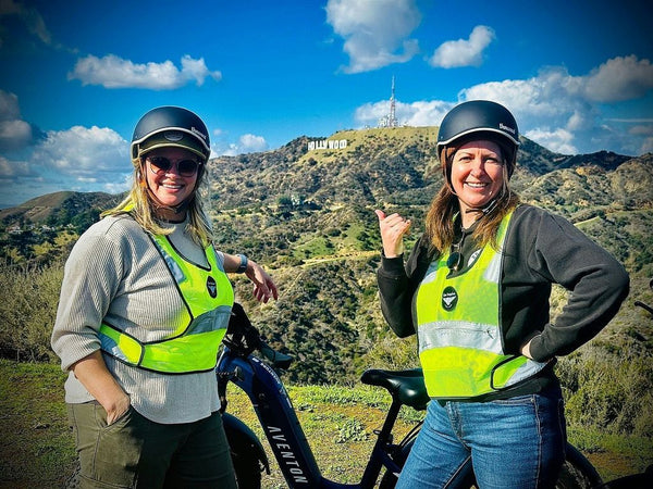 women with hollywood sign