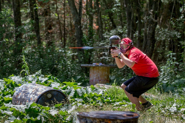 guy shooting paintball