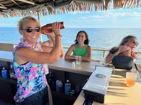 couple with sunset on tiki boat