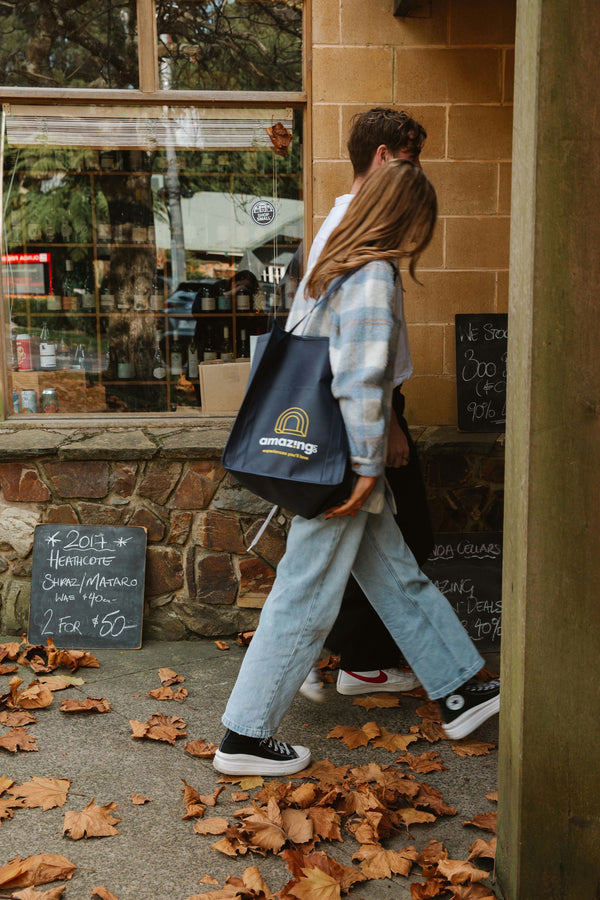 walking into a food shop with picnic bag